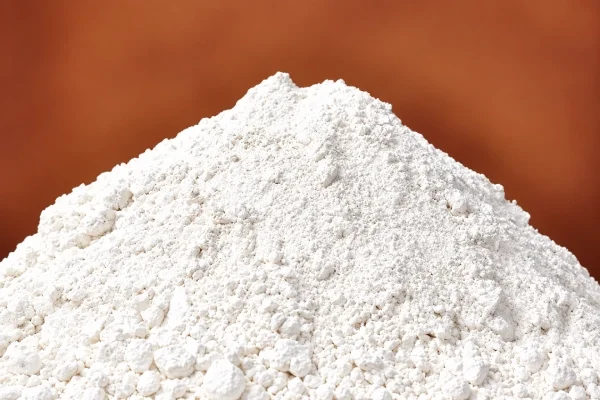 Dolomite rock pieces beside a heap of dolomite powder